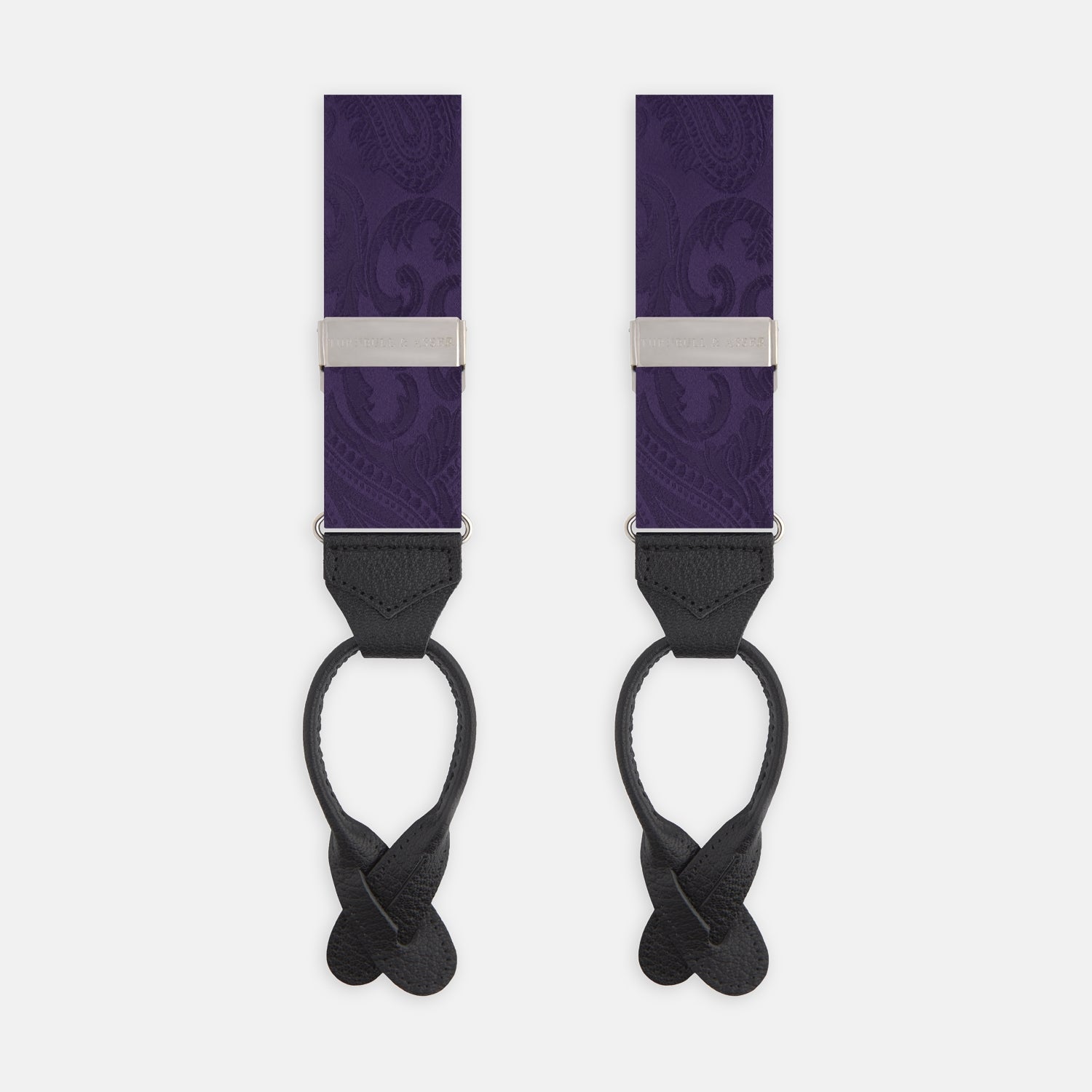 View 1 of product Turnbull & Asser's Purple Paisley Adjustable Silk Braces feature black leather loops and silver adjusters, offering refined sartorial style. Shown against a white background.