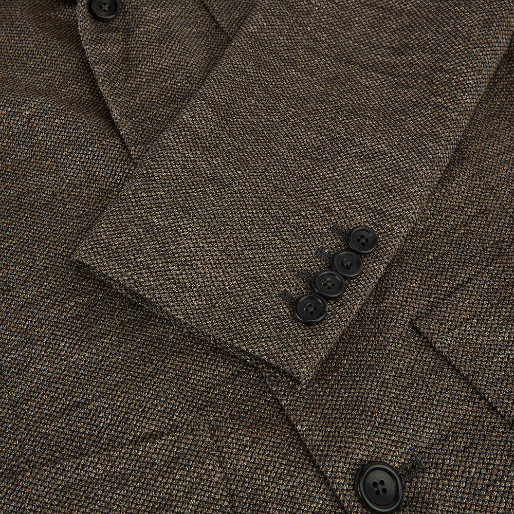 The Turnbull & Asser Pine Cone Linen Blend Cambridge blazer features a textured brown finish, notched lapel, two buttons, patch and chest pockets—showcasing classic British tailoring against a plain white background.
