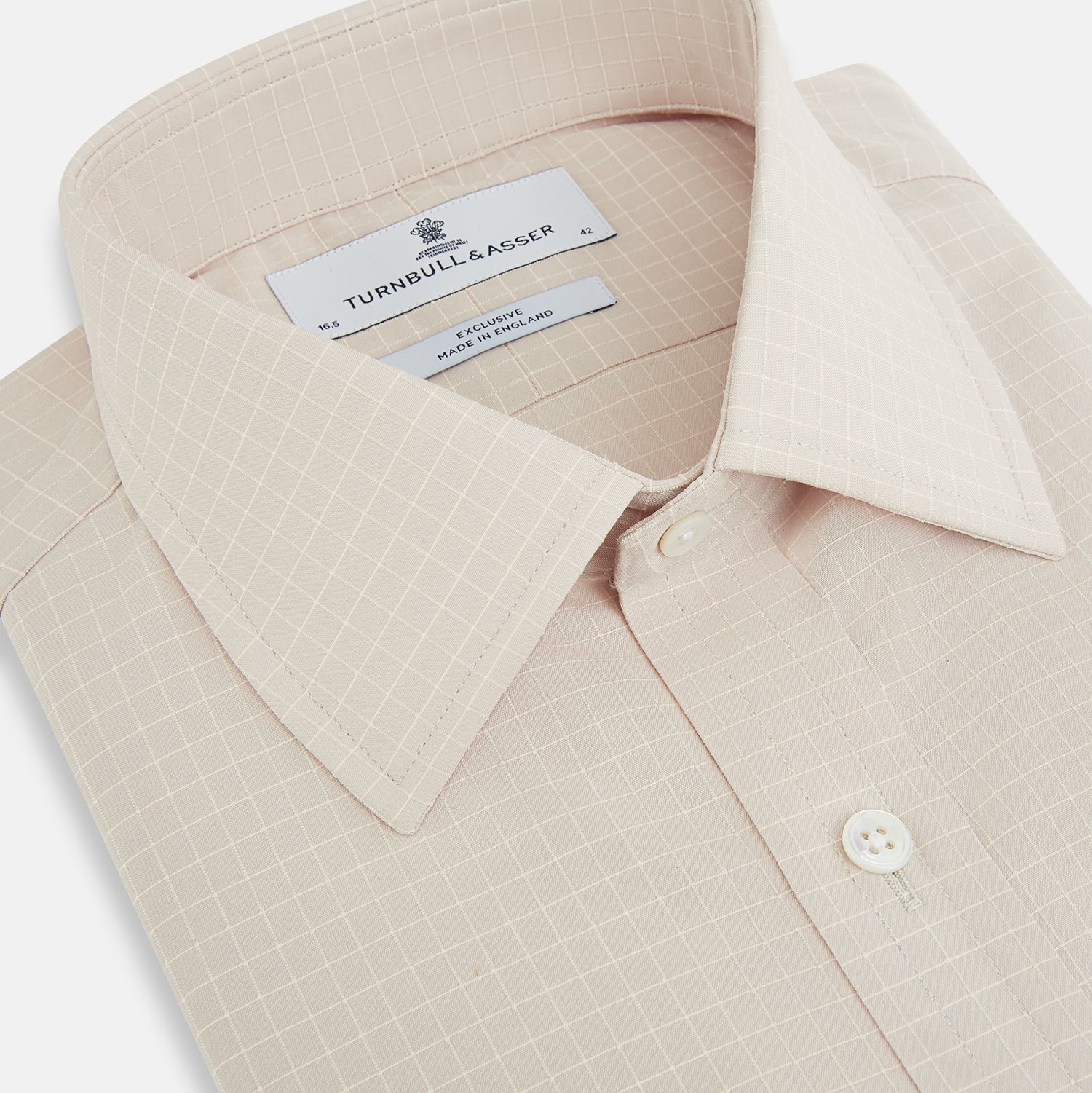 View 2 of product The Turnbull & Asser Pale Pink Fine Check Mayfair Shirt features long sleeves, a collared neckline, buttoned cuffs, and a subtle check pattern in sanforised cotton, displayed against a white background.