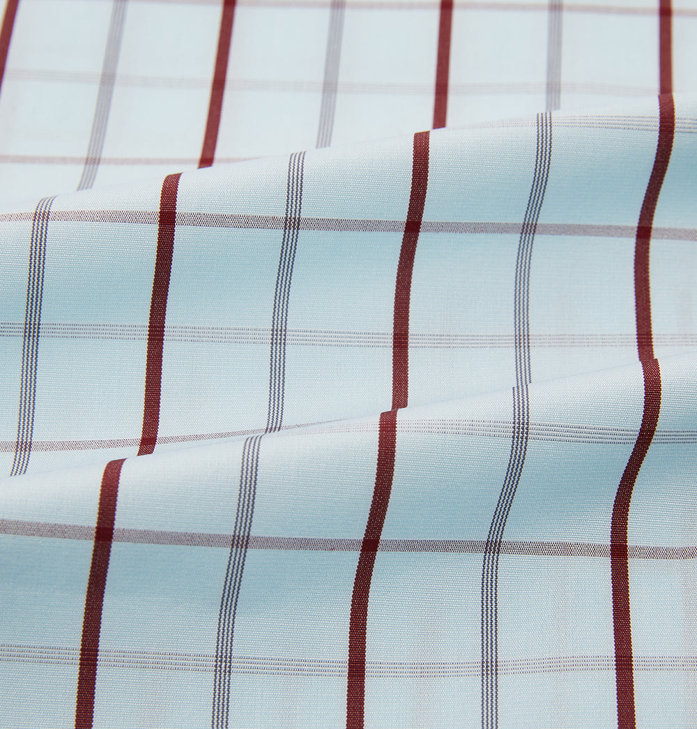 The Turnbull & Asser Burgundy Combination Check Mayfair Shirt is a long-sleeve button-up dress shirt with a check pattern, ideal for formal wear and shown on a plain white background.