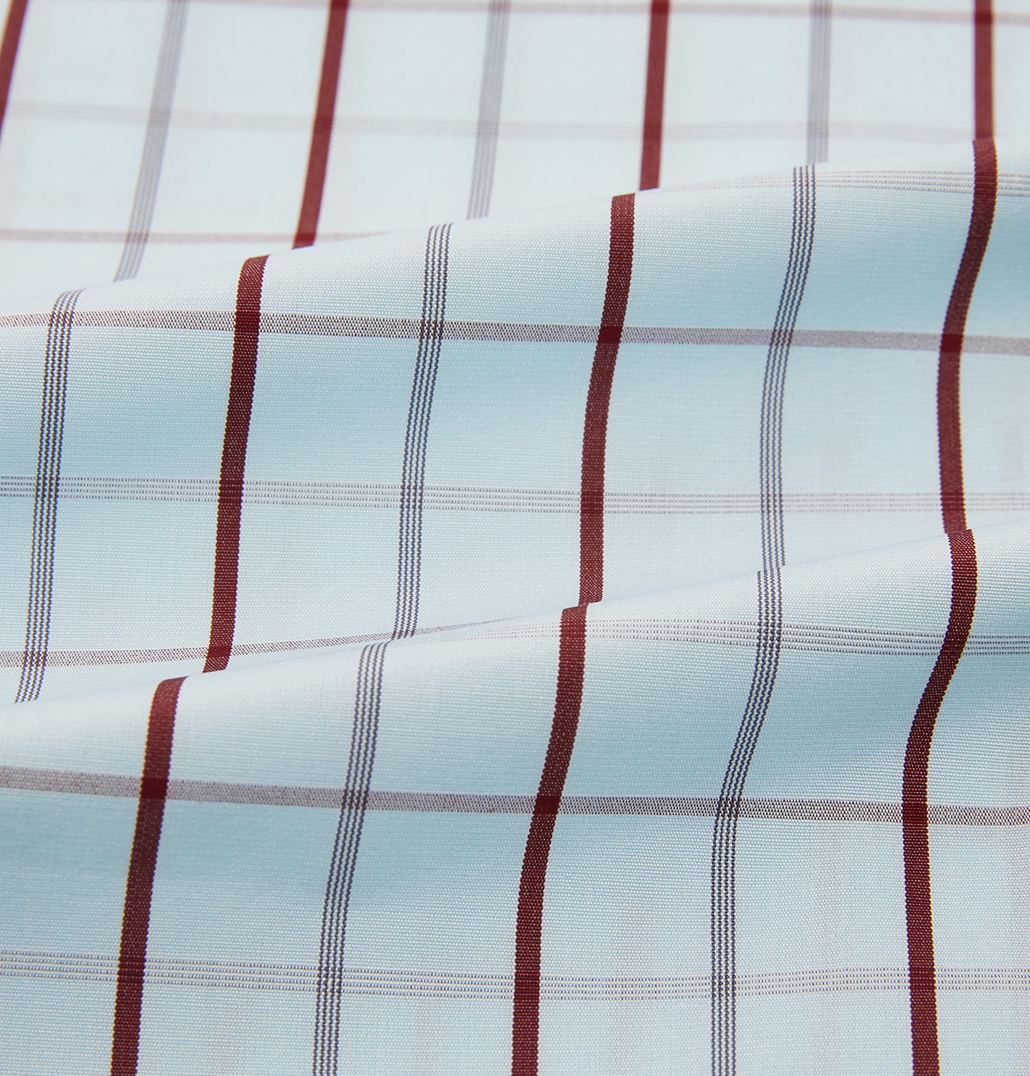 View 6 of product The Turnbull & Asser Burgundy Combination Check Mayfair Shirt is a long-sleeve button-up dress shirt with a check pattern, ideal for formal wear and shown on a plain white background.
