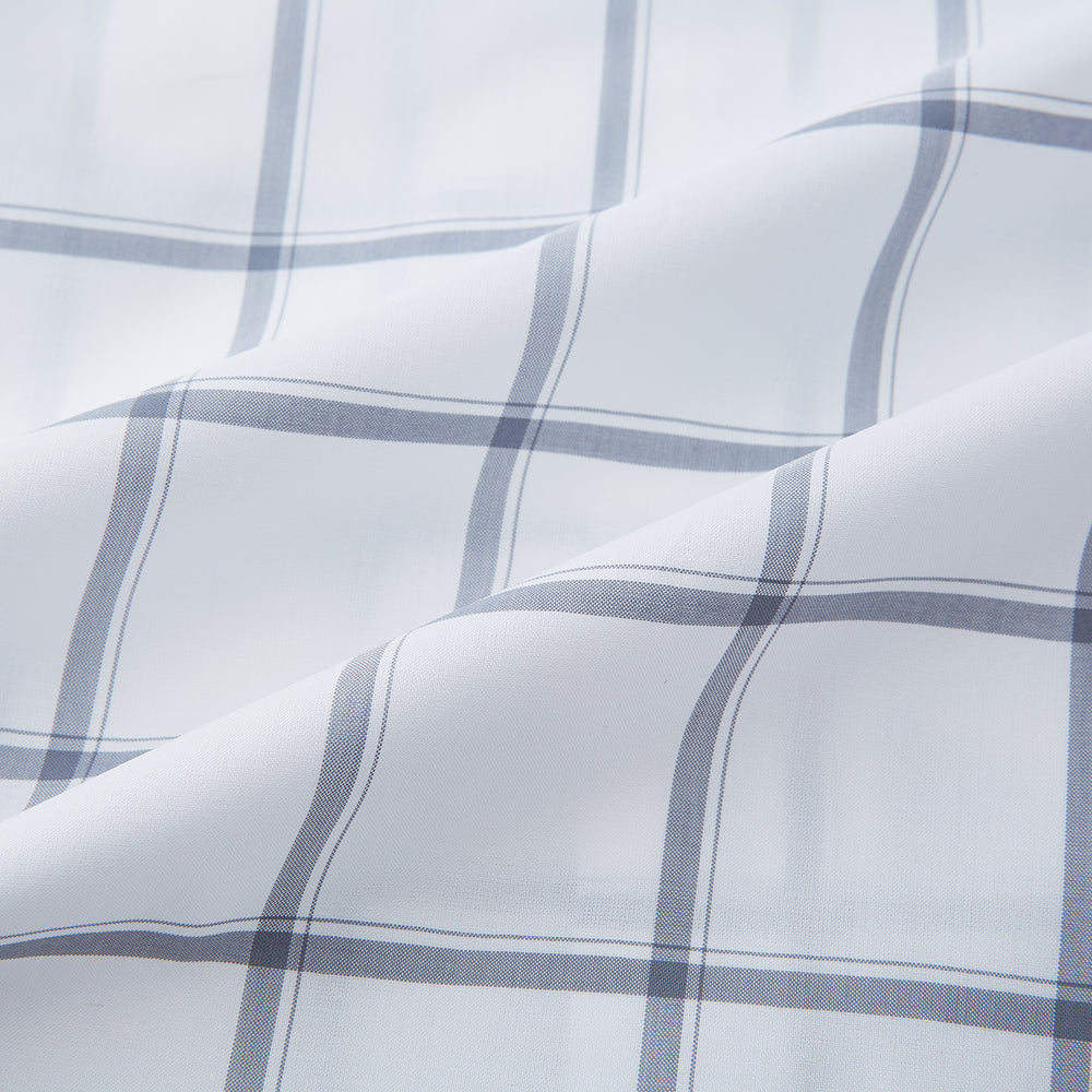 The Turnbull & Asser Grey Grid Check Mayfair Shirt features a classic collar and buttoned cuffs, crafted from fine Italian cotton with a grey grid check on white, and is shown against a plain white background.