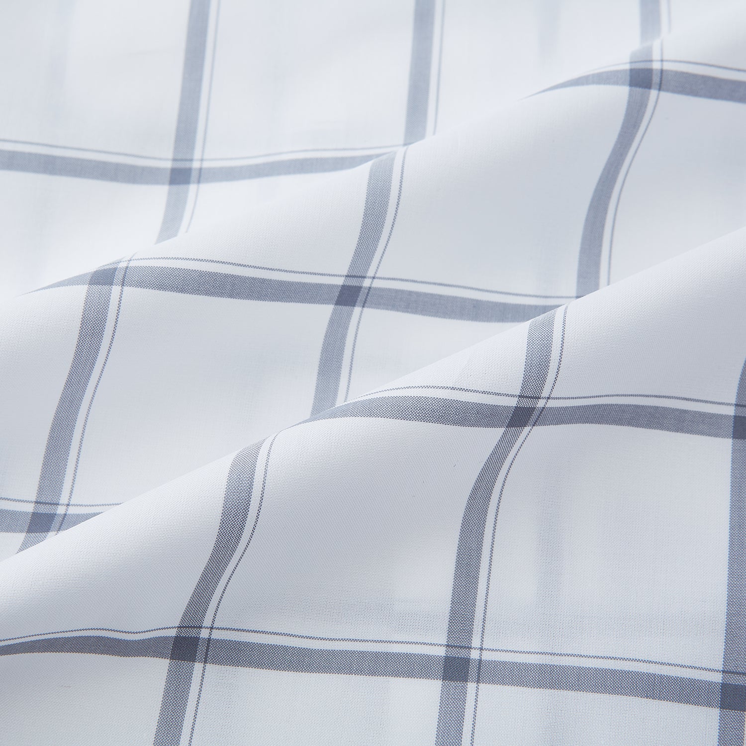 View 6 of product The Turnbull & Asser Grey Grid Check Mayfair Shirt features a classic collar and buttoned cuffs, crafted from fine Italian cotton with a grey grid check on white, and is shown against a plain white background.