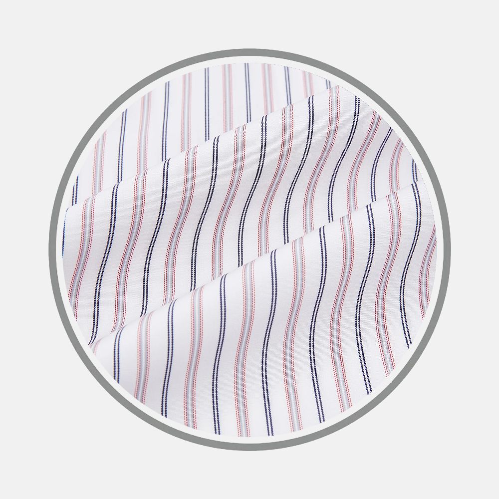 Close-up of Turnbull & Asser's Red Multi Stripe Fabric, featuring white fabric with alternating thin red and blue vertical stripes, shown slightly folded within a circular gray border to highlight its texture and pattern.