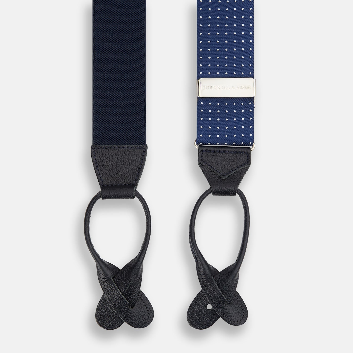 View 3 of product Turnbull & Asser Navy & White Small Spot Adjustable Silk and Navy Leather Braces feature silver-engraved clips and leather button loops—perfect for refined sartorial style.