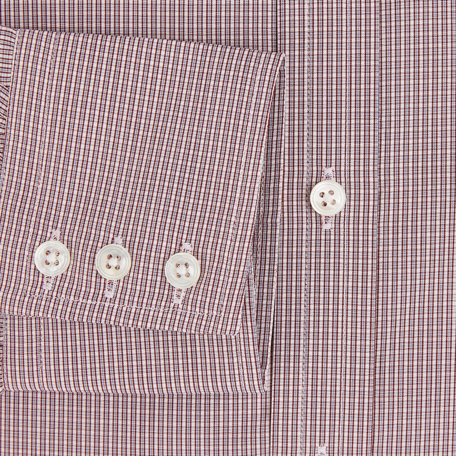 View 4 of product The Turnbull & Asser Burgundy Micro Shadow Check Mayfair Shirt features long sleeves, a classic collar, and white buttons. In light red and white shades, this button-up is perfect for formal wear and is shown laid flat against a white background.