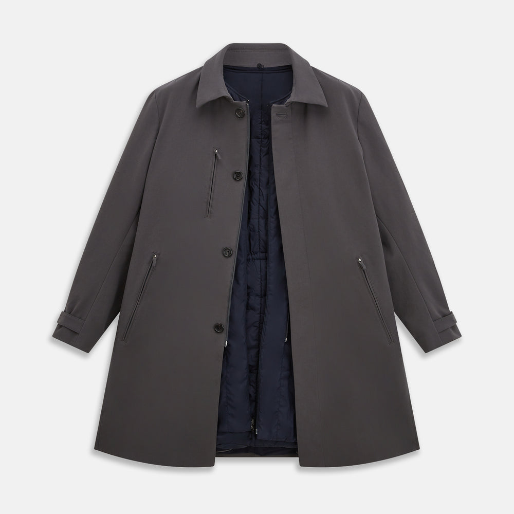 The Turnbull & Asser Charcoal Melange John Arthur Trench Coat, featuring a collar, single-breasted closure, and three zippered pockets—one chest and two at the hips—is shown against a plain white background.