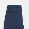 View 5 of product Turnbull & Asser Denim Blue Linen Herringbone Miles Trousers with a straight-leg fit, elasticated waist, and drawstring tie, shown against a plain white background.