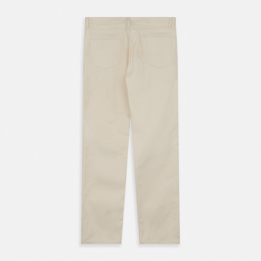 A pair of Turnbull & Asser Ecru Sanforized Denim Jeans with five pockets, button closure, and silver rivets, shown against a plain white background.