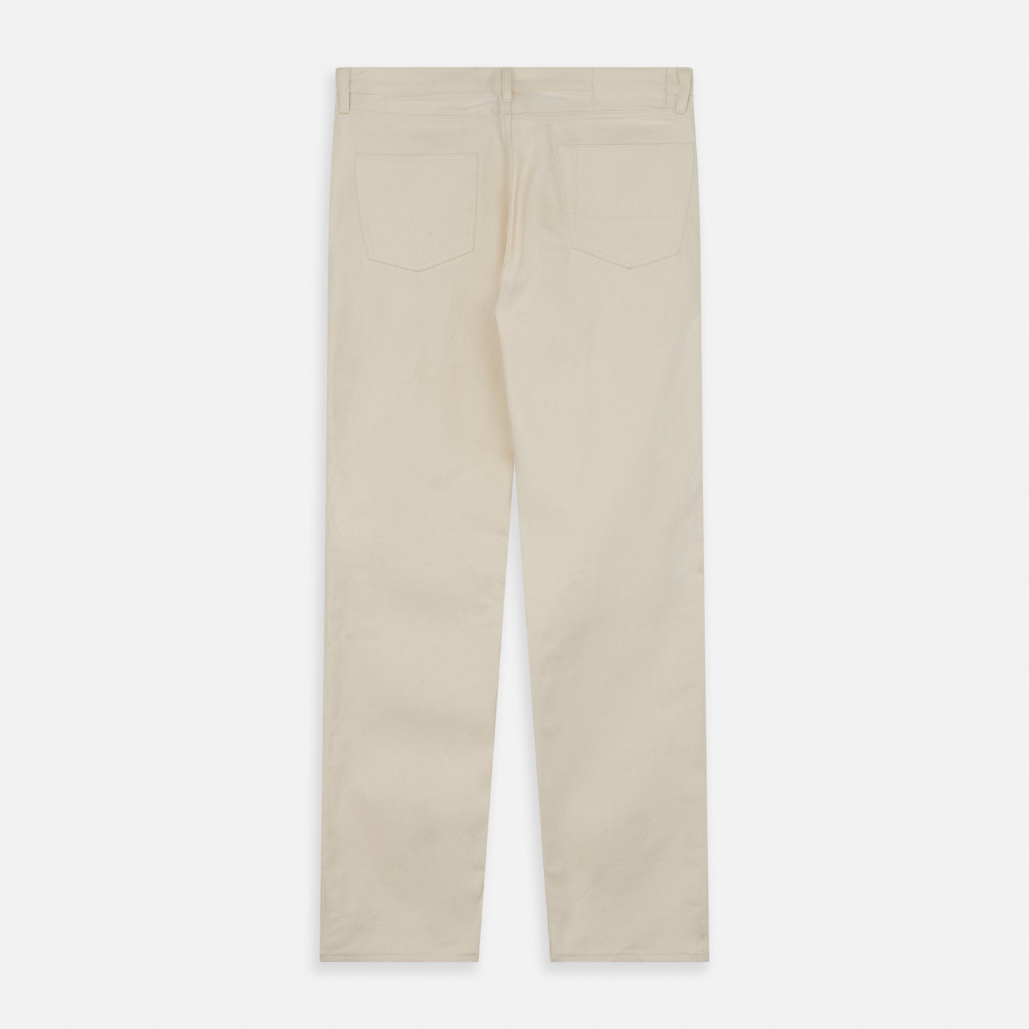 View 4 of product A pair of Turnbull & Asser Ecru Sanforized Denim Jeans with five pockets, button closure, and silver rivets, shown against a plain white background.