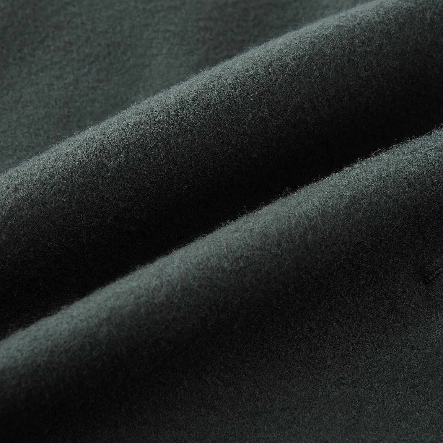 View 5 of product The Turnbull & Asser Moss Green Apsley Single-Breasted Caban Coat, featuring three buttons, a notched lapel, and three front pockets, is showcased on a plain white background.