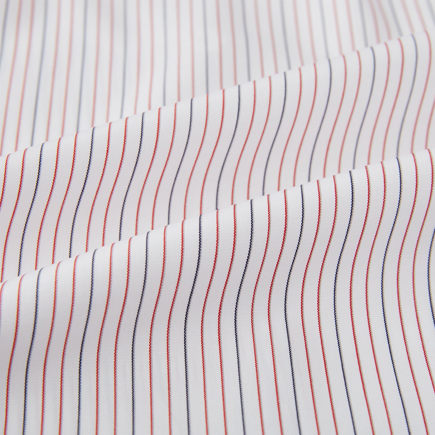 View 8 of product The Turnbull & Asser Red and Blue Ticking Stripe Westminster Shirt features long sleeves, a button-up front, pointed collar, and buttoned cuffs, highlighting British craftsmanship while laid flat on a white background.