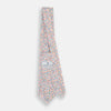 View 4 of product The Turnbull & Asser Confetti Circle White Silk Tie features colorful rings in red, orange, blue, and green scattered across a crisp white background.