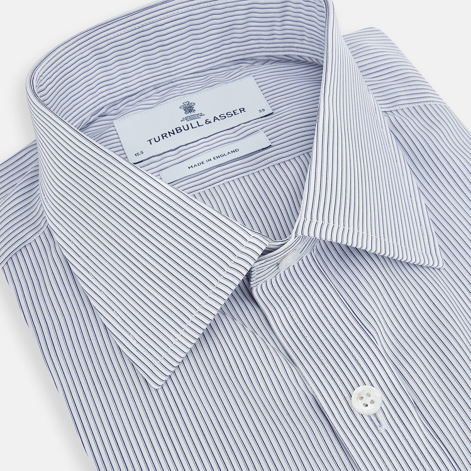 View 2 of product The Navy and White Ticking Stripe Mayfair Shirt by Turnbull & Asser features long sleeves, buttoned cuffs, a pointed T&A collar, and button-up front, shown on a plain white background.