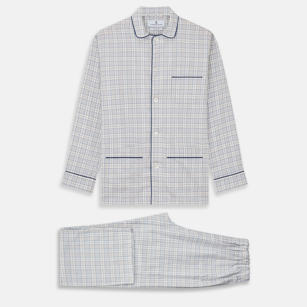 The Turnbull & Asser Blue Multi Check Cotton-Cashmere Modern Pyjama Set features a two-piece design with a long-sleeve button-up top with breast pocket and matching elastic-waist pants in a blue and white check pattern.