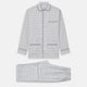 The Turnbull & Asser Blue Multi Check Cotton-Cashmere Modern Pyjama Set features a two-piece design with a long-sleeve button-up top with breast pocket and matching elastic-waist pants in a blue and white check pattern.