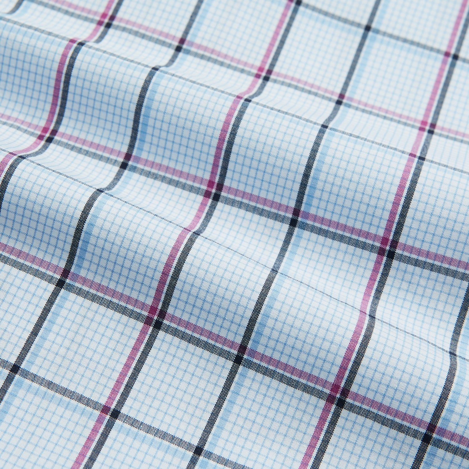 View 5 of product The Turnbull & Asser Blue and Pink Tattersall Check Mayfair Shirt features a classic tattersall pattern with a T&A collar and cuffed sleeves.