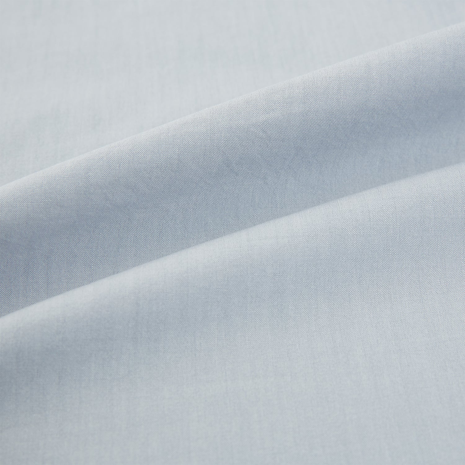 View 6 of product The Dove Grey Mayfair Shirt by Turnbull & Asser is a long-sleeve button-up with a collar, front pocket, and white buttons, crafted from soft sanforised cotton and laid flat on a white background.