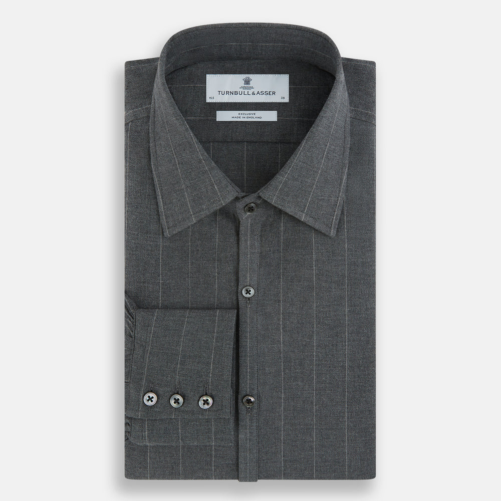 The Charcoal Melange Wide Stripe Westminster Shirt from Turnbull & Asser features long sleeves, a tailored fit, pointed collar, buttoned cuffs, and subtle wide stripes, shown laid flat on a white background.