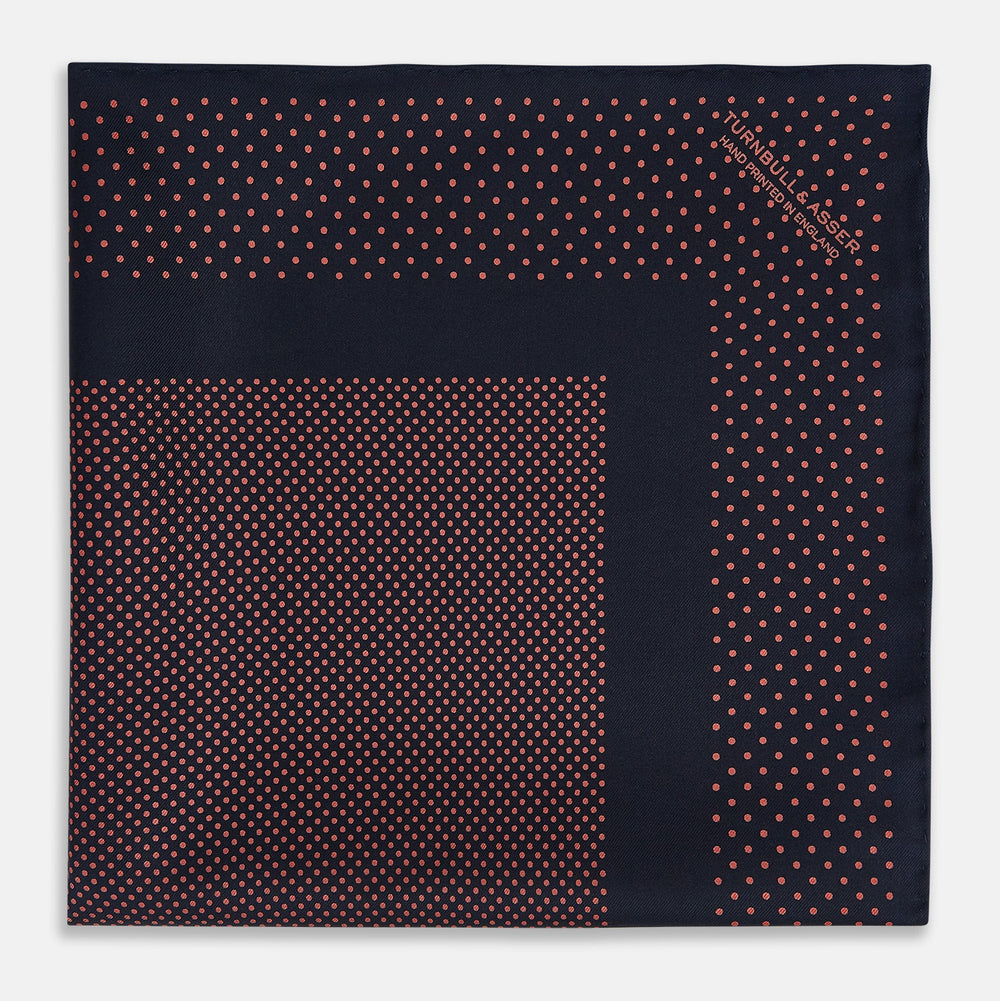 The Turnbull & Asser Navy and Orange Dot Silk Pocket Square features exquisite handmade craftsmanship.