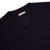 View 2 of product The Turnbull & Asser Dark Purple Fine Merino V-Neck Jumper features long sleeves and a classic knit, shown against a white background.