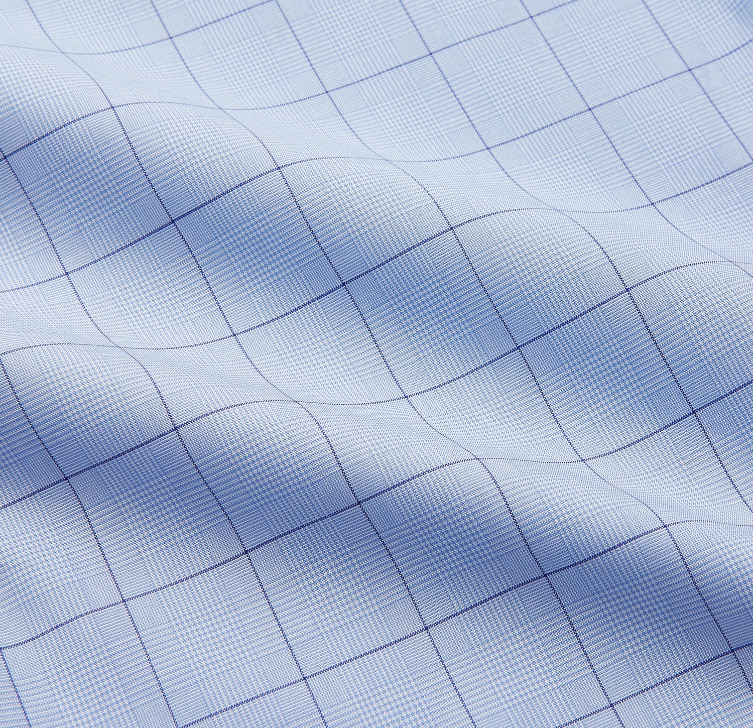 View 5 of product The Blue Prince of Wales Check Mayfair Shirt by Turnbull & Asser features a light blue check pattern, white buttons, and a classic collar. Crafted from premium Italian cotton, it is displayed on a plain white background.