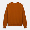 View 3 of product The Turnbull & Asser Rust Paden V-Neck Jumper, a pure cashmere sweater with long sleeves and ribbed cuffs and hem, is laid flat on a white background with the label visible at the neck.