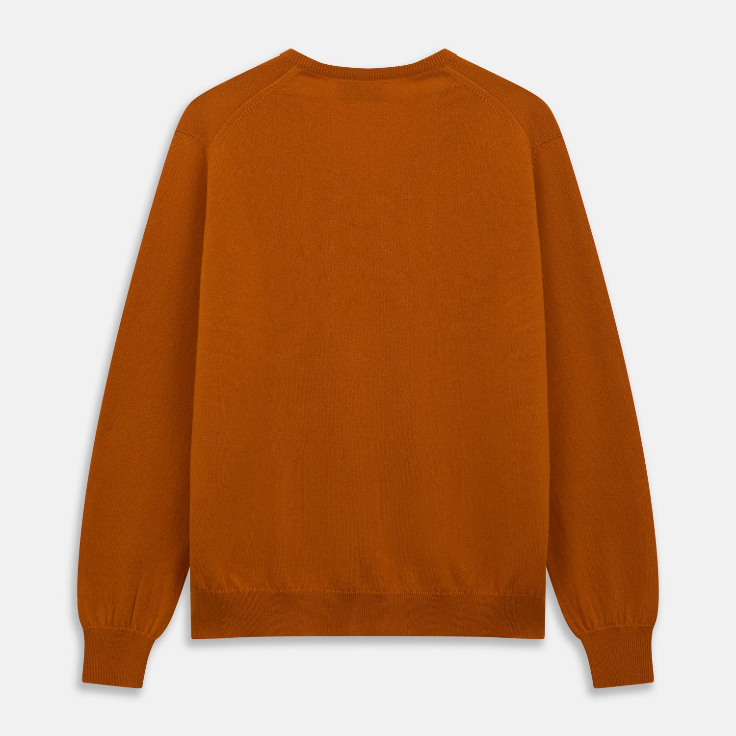 View 3 of product The Turnbull & Asser Rust Paden V-Neck Jumper, a pure cashmere sweater with long sleeves and ribbed cuffs and hem, is laid flat on a white background with the label visible at the neck.