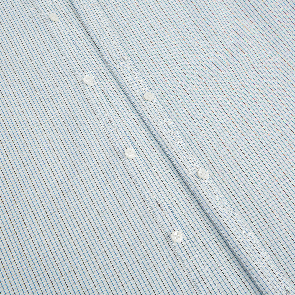 The Pale Blue and Navy Grid Check Westminster Shirt by Turnbull & Asser features a button-down front and pointed collar, highlighting fine British craftsmanship, displayed on a white background.