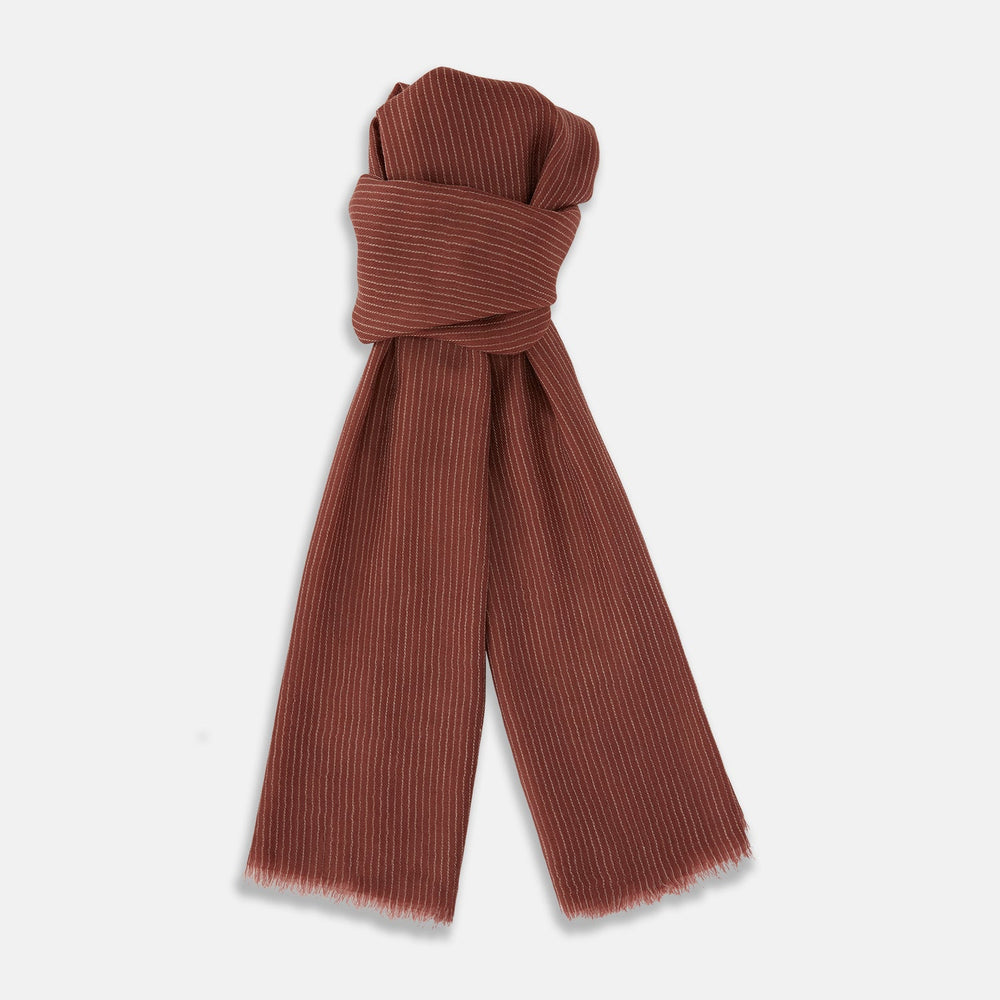 A Burgundy and White Striped Cashmere Scarf by Turnbull & Asser is neatly folded on a plain, light gray background.