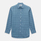 The Turnbull & Asser Steel Grey Grid Check Mayfair Shirt is a long-sleeve, button-up shirt in light blue Italian cotton, shown against a plain white background.