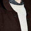 View 3 of product The Burgundy Grayson Car Coat by Turnbull & Asser, made from a rain-resistant cotton blend with a collar, hidden front buttons, and slanted pockets, is displayed flat on a white background in a minimalist style.
