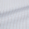 View 6 of product The Turnbull & Asser Pale Blue and Grey Grid Check Mayfair Shirt features long sleeves, a pointed collar, and buttoned cuffs. Crafted from Italian cotton, it displays a subtle grid pattern on a plain white background.