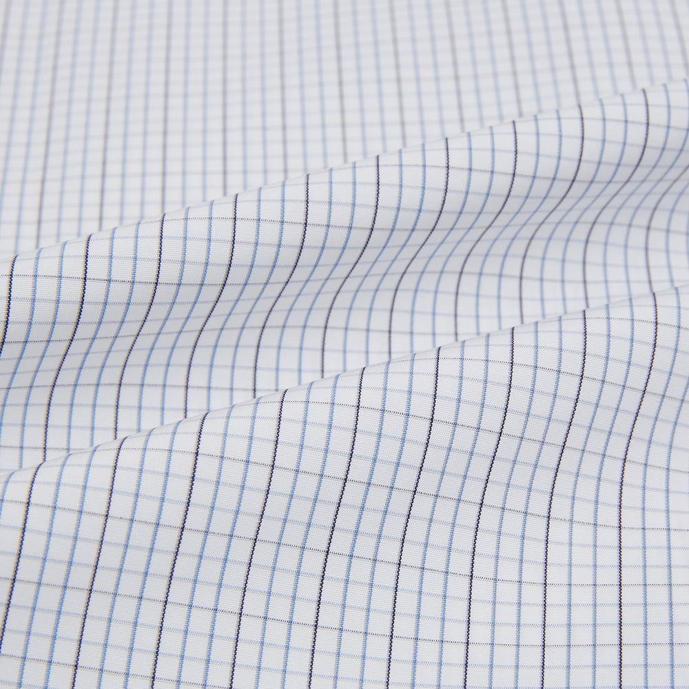 The Turnbull & Asser Pale Blue and Grey Grid Check Mayfair Shirt features long sleeves, a pointed collar, and buttoned cuffs. Crafted from Italian cotton, it displays a subtle grid pattern on a plain white background.