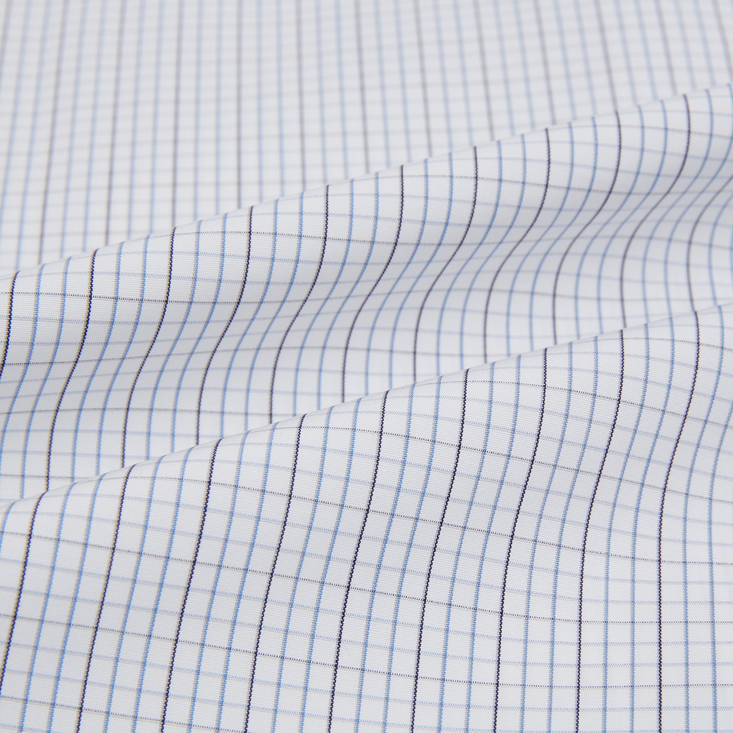 View 6 of product The Turnbull & Asser Pale Blue and Grey Grid Check Mayfair Shirt features long sleeves, a pointed collar, and buttoned cuffs. Crafted from Italian cotton, it displays a subtle grid pattern on a plain white background.