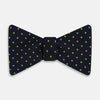 View 1 of product The Turnbull & Asser Lime Green and Navy Micro Dot Silk Bow Tie features small lime green dots on navy silk, displayed against a plain white background.
