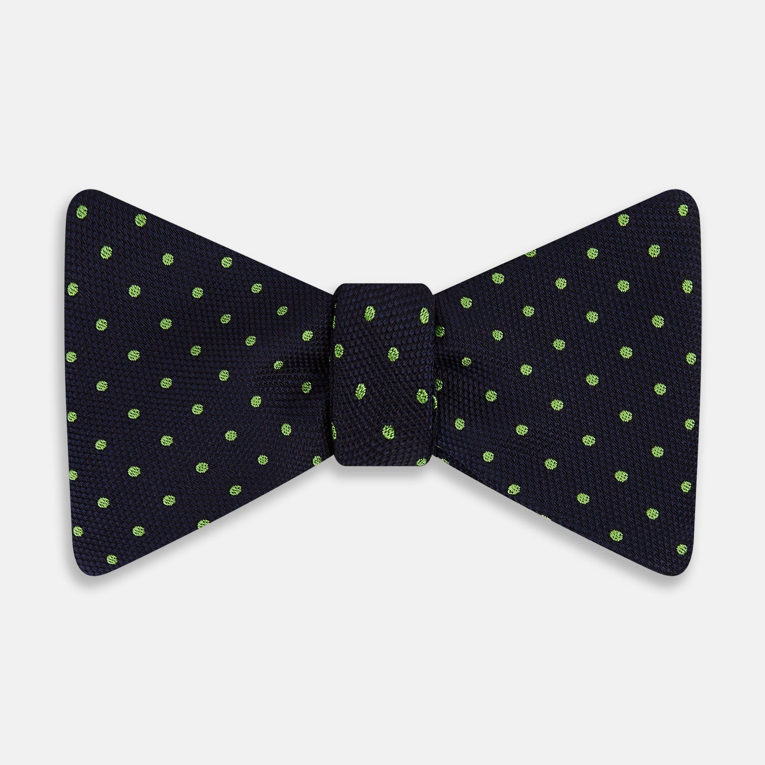 View 1 of product The Turnbull & Asser Lime Green and Navy Micro Dot Silk Bow Tie features small lime green dots on navy silk, displayed against a plain white background.
