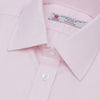 View 5 of product A Pink Herringbone Superfine Cotton Shirt by Turnbull & Asser, featuring a T&A collar and 3-button cuffs, is neatly folded with the inner collar label visible and white buttons, set against a plain white background.