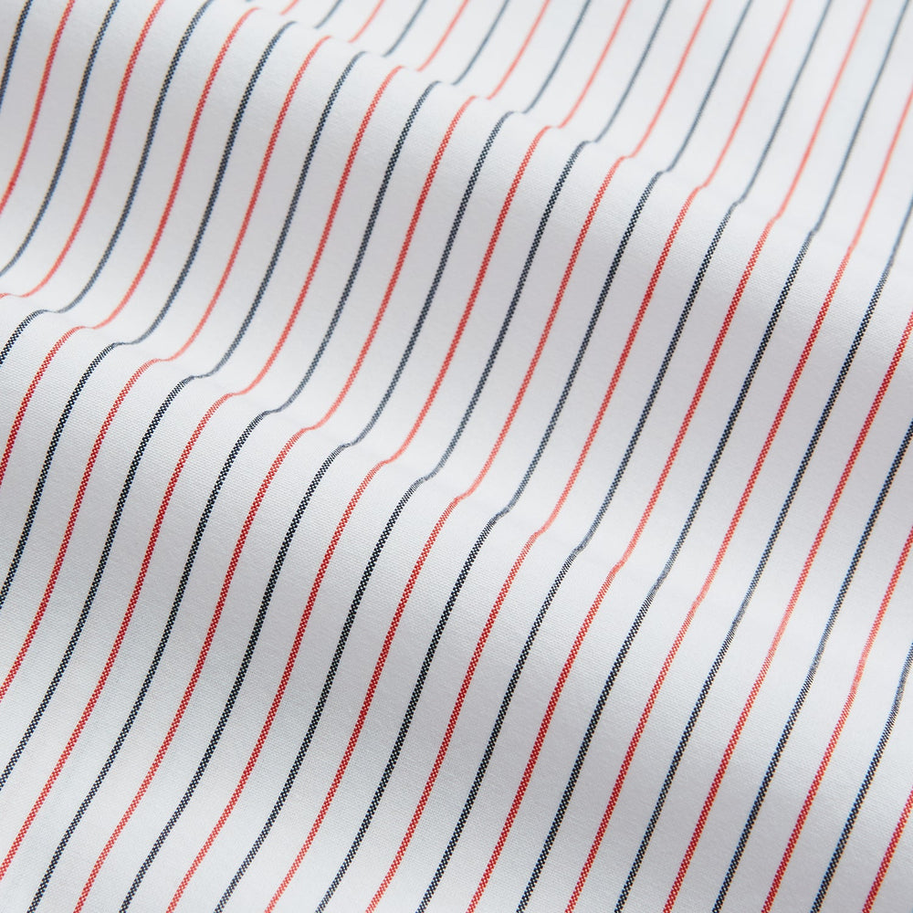 The Turnbull & Asser Hand Rolled Red and Navy Pinstripe Handkerchief features evenly spaced vertical stripes on white cotton, offering a clean, classic look as an elegant gentleman's accessory or stylish pocket square.