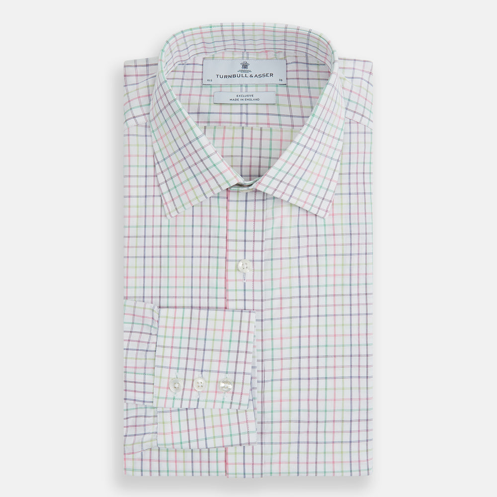 The Turnbull & Asser Multicoloured Double Grid Check Mayfair Shirt, made from organic cotton, features long sleeves, a collar, and a blue, green, and red grid check on white. The shirt is shown neatly laid flat against a white background.
