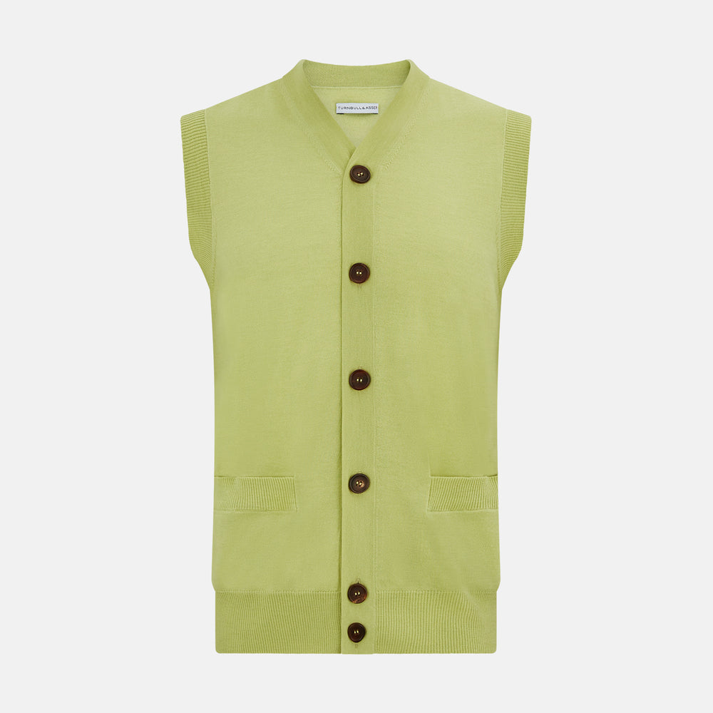 The Melon Green Fine Merino V-Neck Sleeveless Cardigan by Turnbull & Asser features a ribbed collar, five dark brown buttons, and two front pockets—adding sophisticated style to any ensemble, shown against a plain white background.