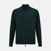 View 1 of product The Turnbull & Asser Forest Green Merino High Neck Zipped Cardigan features long sleeves, a ribbed high neck, cuffs, and hem, shown against a plain white background.
