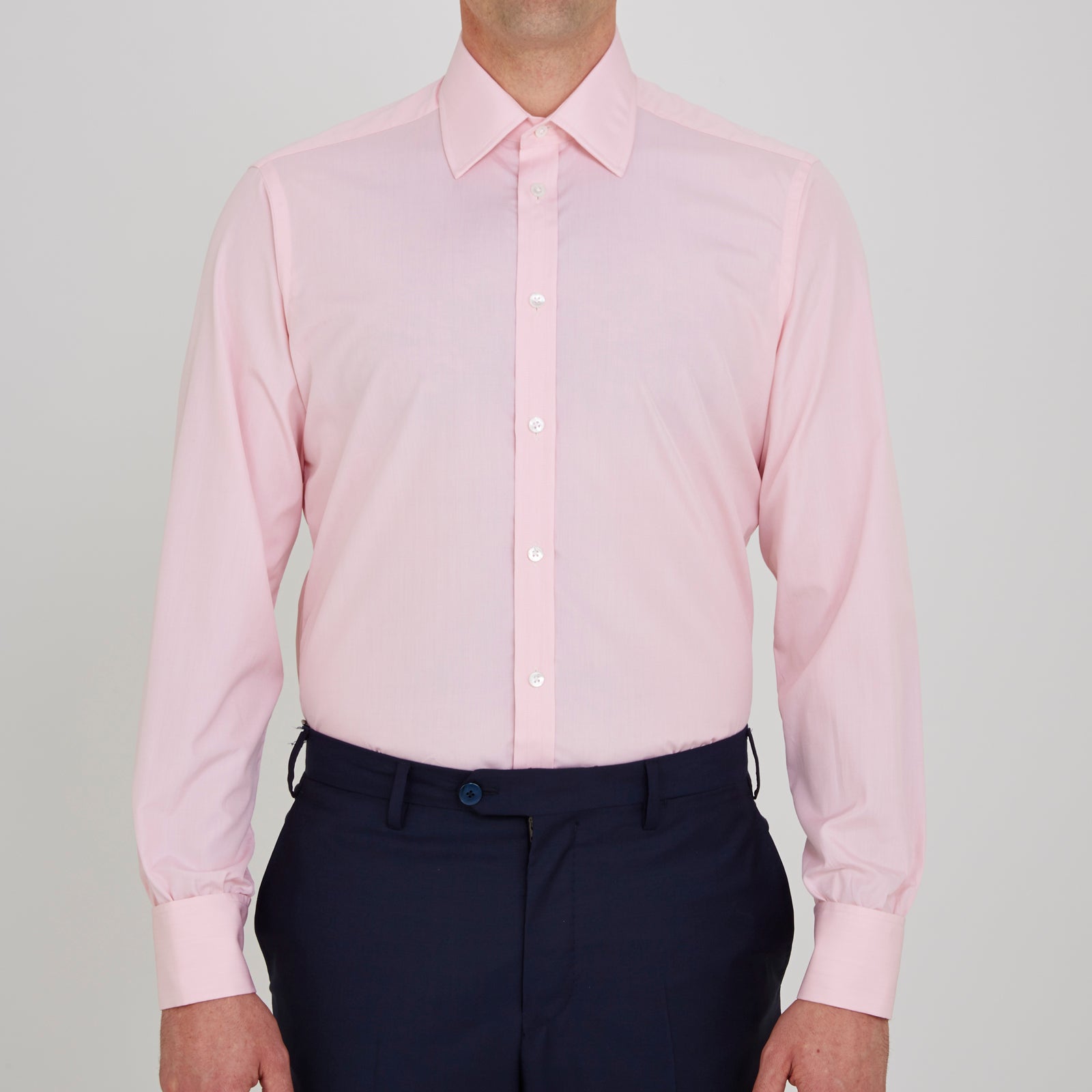 View 2 of product The Pink End-on-End Shirt with T&A Collar and Double Cuffs by Turnbull & Asser, shown neatly folded on a white background, updates timeless elegance with its classic detailing and refined pink hue.