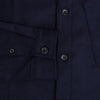 View 4 of product The Turnbull & Asser Midnight Blue Highbury Overshirt, featuring long sleeves, a collar, and a single chest pocket, is shown laid flat against a white background.