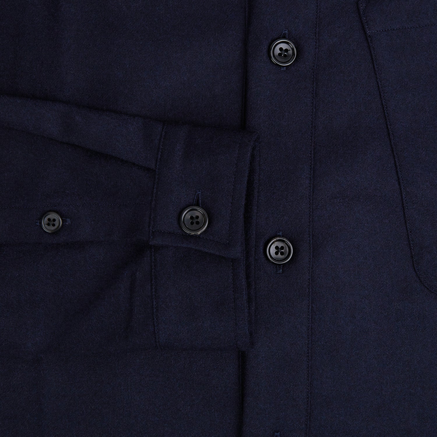 View 4 of product The Turnbull & Asser Midnight Blue Highbury Overshirt, featuring long sleeves, a collar, and a single chest pocket, is shown laid flat against a white background.