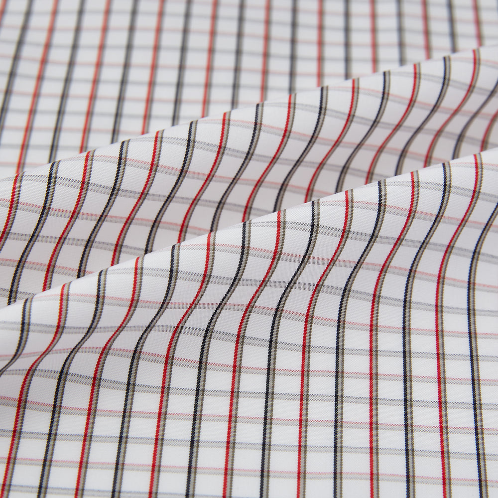 The Turnbull & Asser Red and Midnight Blue Tattersall Check Windsor Shirt features British craftsmanship, shown laid flat with sleeves extended and collar neatly folded.