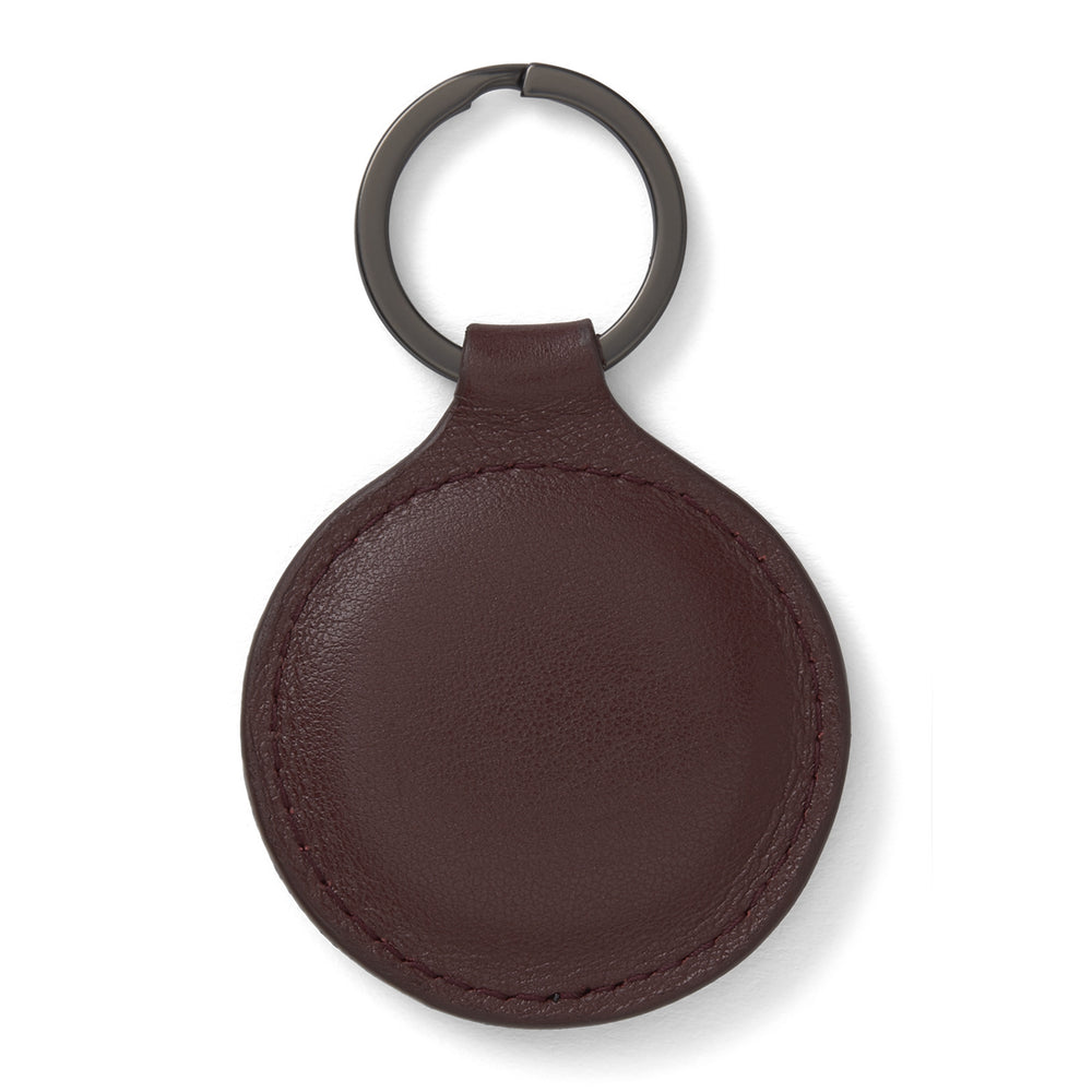 A burgundy leather fob holder by Turnbull & Asser, embossed with the brand name and Made in England, features a metal split keyring at the top.
