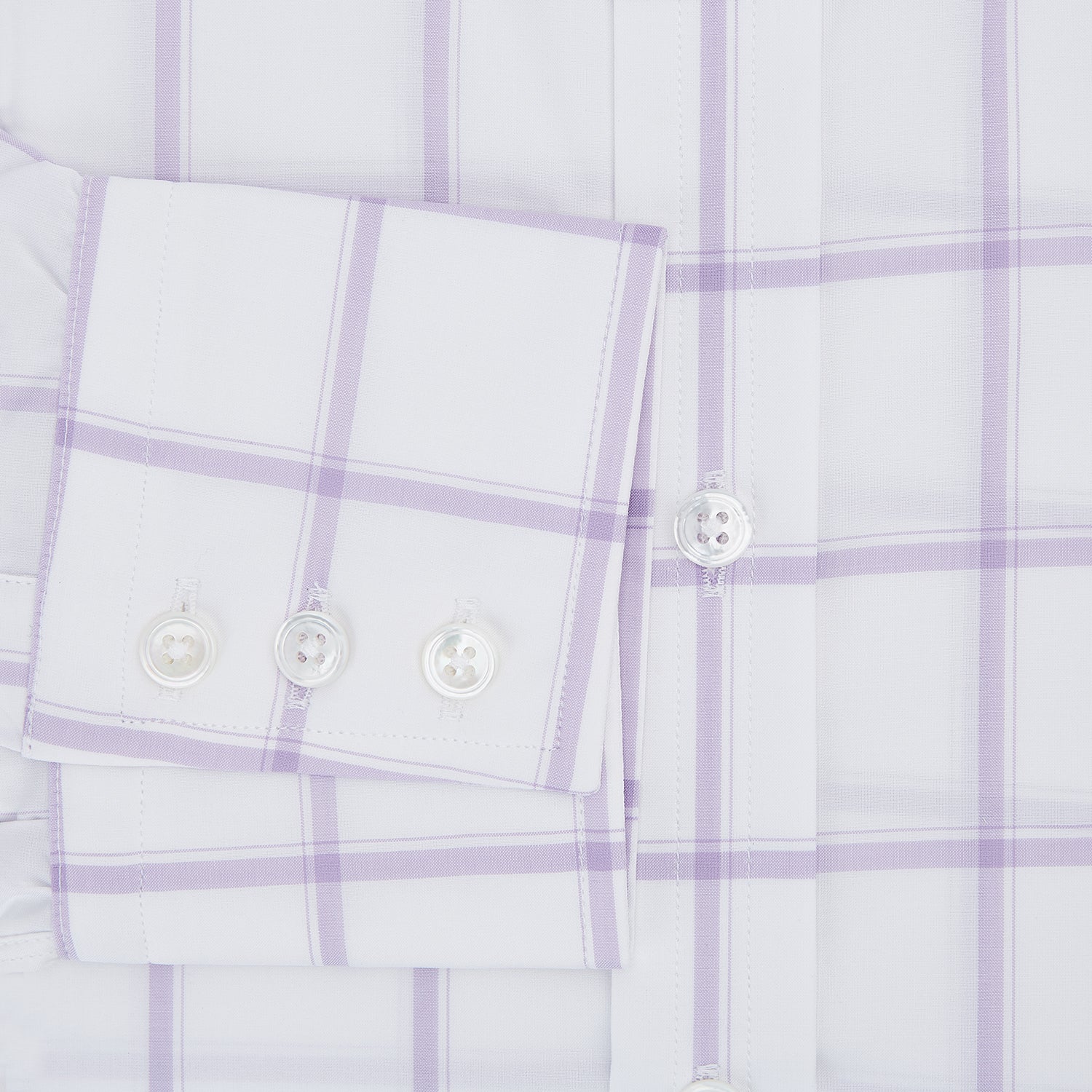 View 4 of product The Turnbull & Asser Lilac Grid Check Mayfair Shirt is a long-sleeve, button-up style crafted from Italian cotton with a white base and lilac grid check pattern, shown on a plain white background.