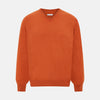 View 1 of product The Turnbull & Asser Rust Cashmere V-neck Jumper features long sleeves, ribbed cuffs and hem, and is shown against a plain white background.