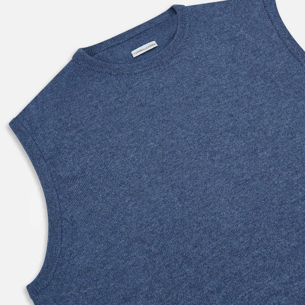 Turnbull & Asser’s Pacific Blue Cashmere Round Neck Vest features a sleeveless design with ribbed collar, armholes, and hem, showcased against a plain white background.